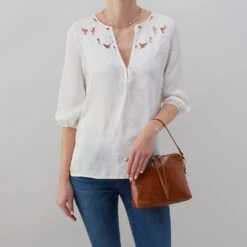 Reeva Crossbody In Polished Leather - Truffle 11 Reeva Crossbody In Polished Leather - Truffle -Hobo Sales Store VI 35857TRUF 05 63f8a6d0 fe4b 4774 9cb3 df2c9682df06